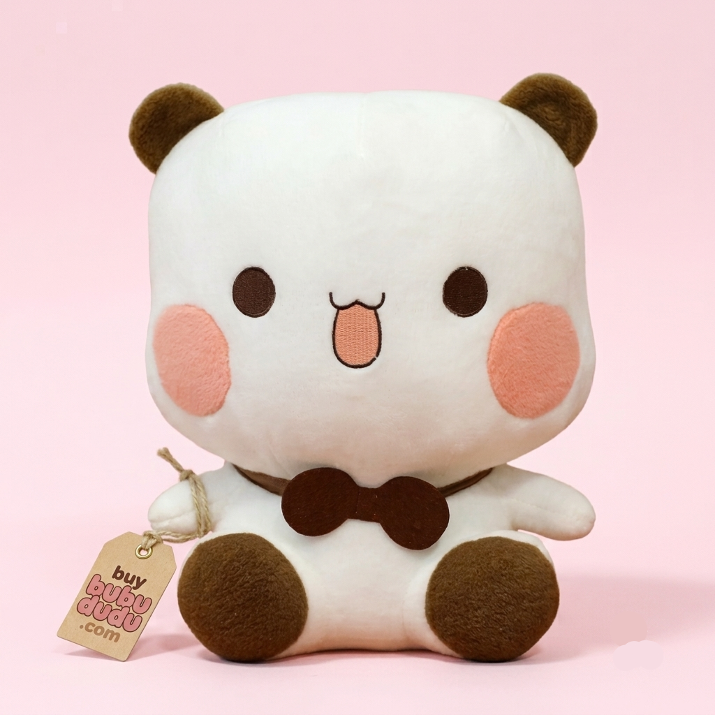 A cute white plush panda toy with brown ears, feet, and bow tie, pink cheeks, and a small stitched tongue sticking out. It is sitting against a solid light pink background and has a paper tag attached that reads 'buy BUBY BUBY.