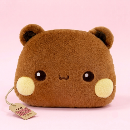 A brown plush bear-shaped pouch with a cute embroidered face, large black eyes, and light yellow cheeks, shown on a solid pink background with a hanging tag.